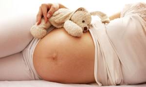 Почему болит поясница при беременности на раннем сроке